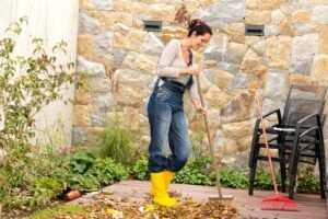 A woman doing yard work.