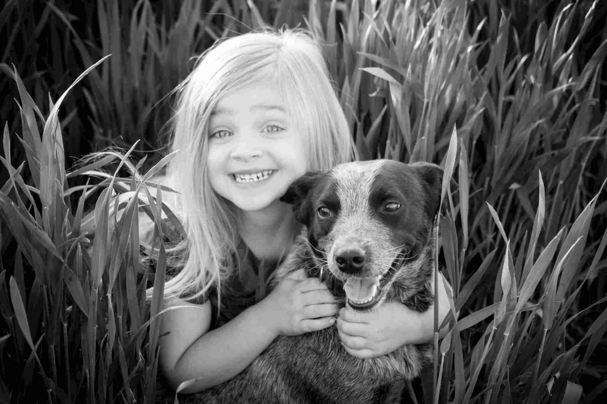 Little girl posing with a dog